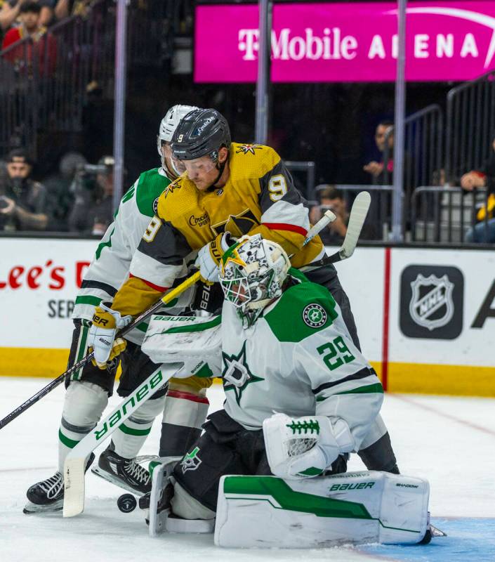 Golden Knights center Jack Eichel (9) battles for a shot against Dallas Stars goaltender Jake O ...