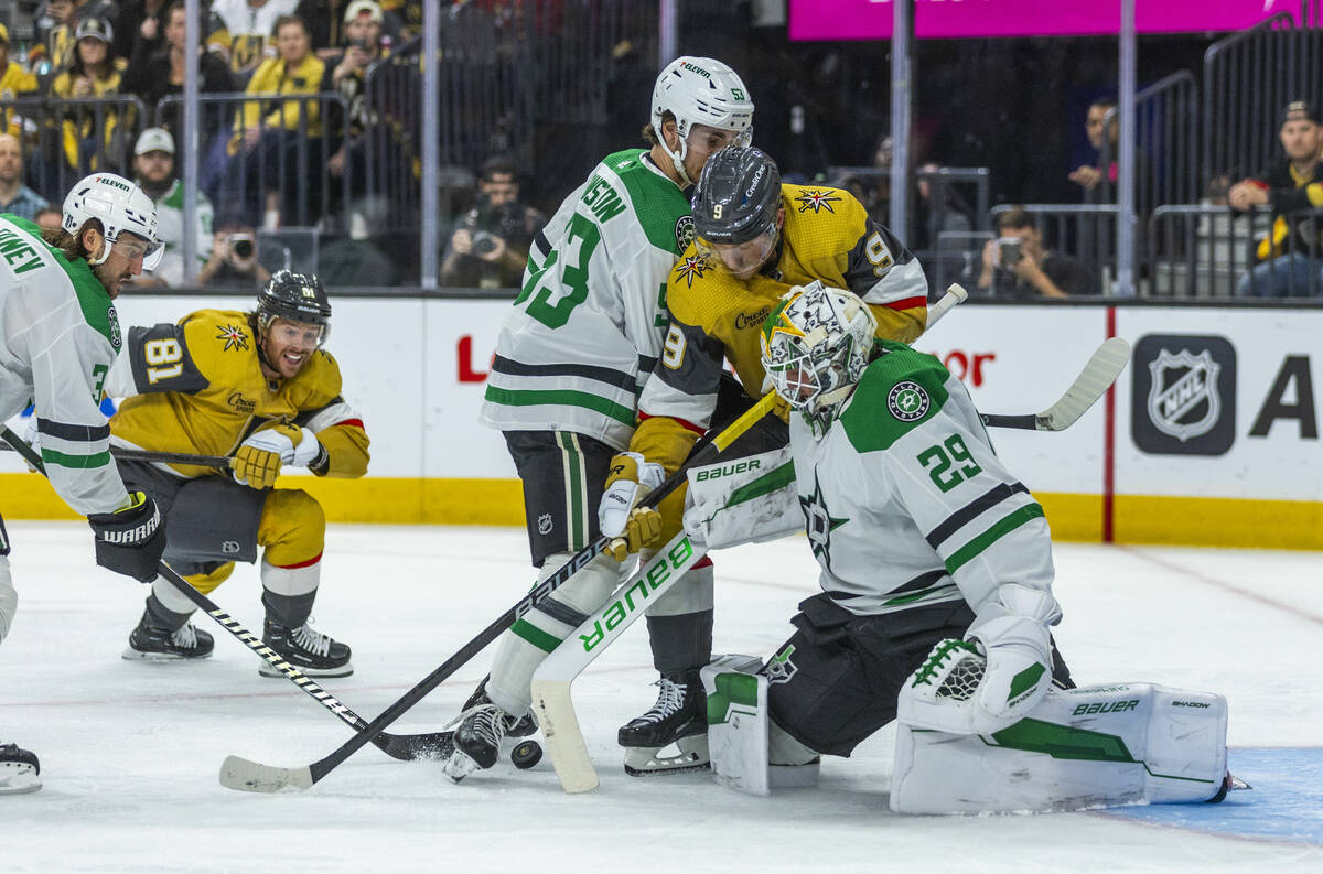 Golden Knights center Jack Eichel (9) battles for a shot against Dallas Stars goaltender Jake O ...