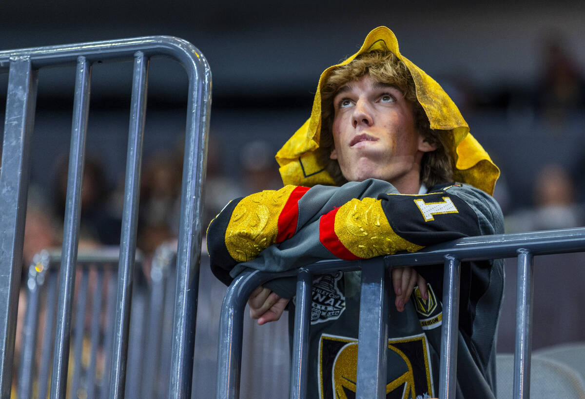 A Golden Knights fan watches the clock tick down as the Dallas Stars are up two scores during t ...