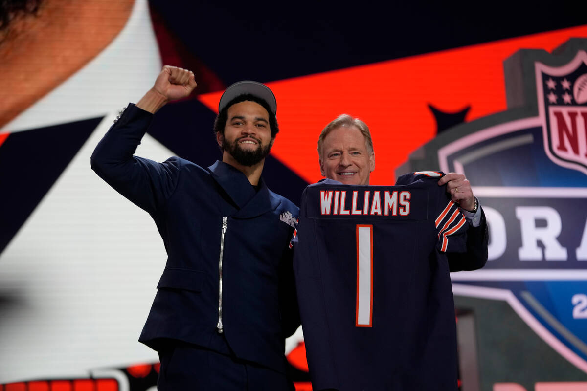 Southern California quarterback Caleb Williams celebrates with NFL commissioner Roger Goodell a ...