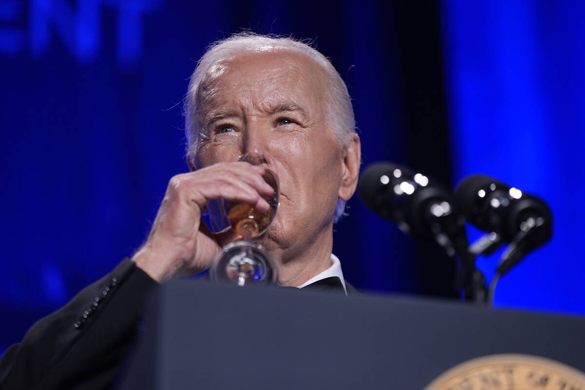 President Joe Biden makes a toast to a free press at the White House Correspondents' Associatio ...