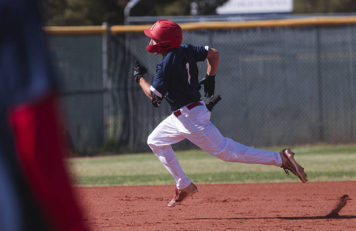 Liberty’s Chris Onoszko runs for third base against Spring Valley during a baseball game ...