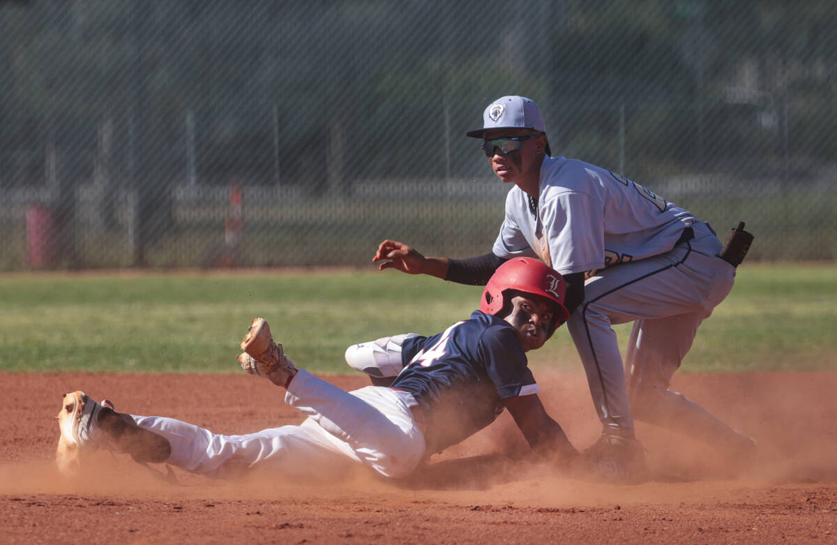 Liberty outfielder Rashaan Chavis (34) steals second base against Spring Valley's Royce Ogawa ( ...