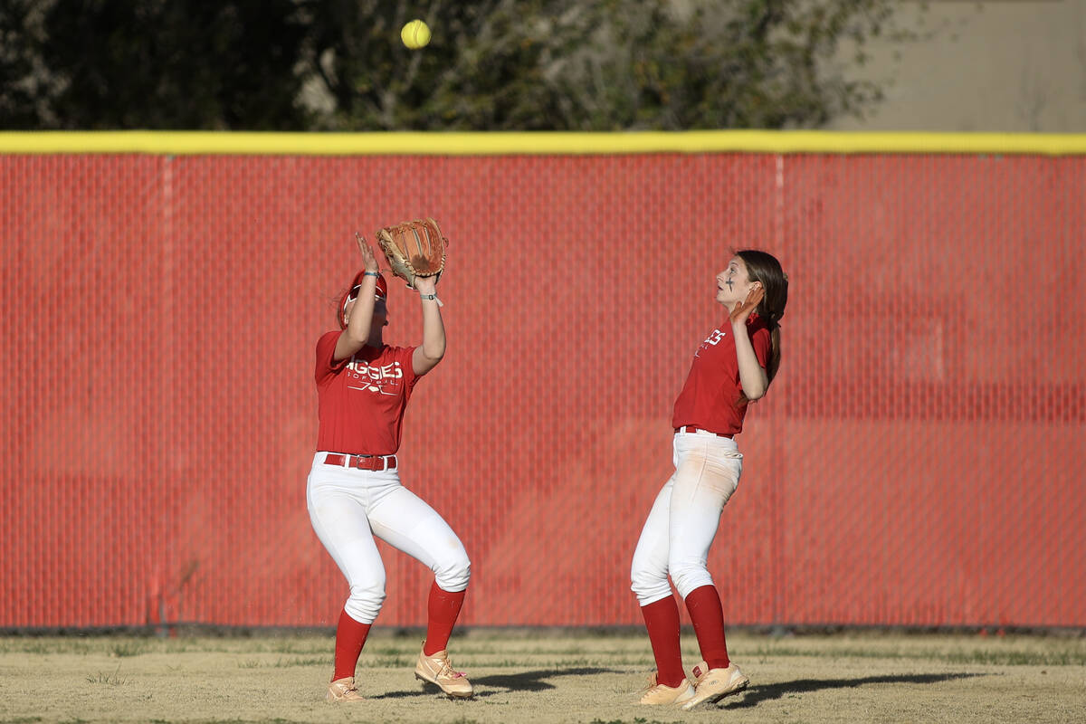 Arbor View’s Breya Hee, left, prepares to catch for an out over Centennial during a high ...