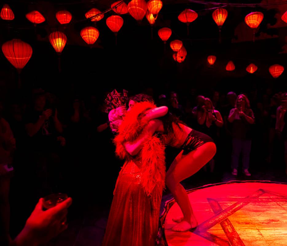 Artistic director and dancer Patricia Bouchebel, right, hugs singer and emcee Cora Vette after ...