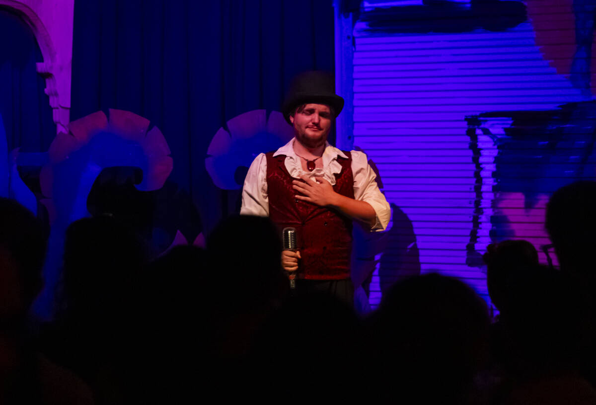 Emcee and magician William Bradshaw reacts during the closing night of Lost Spirits Distillery ...
