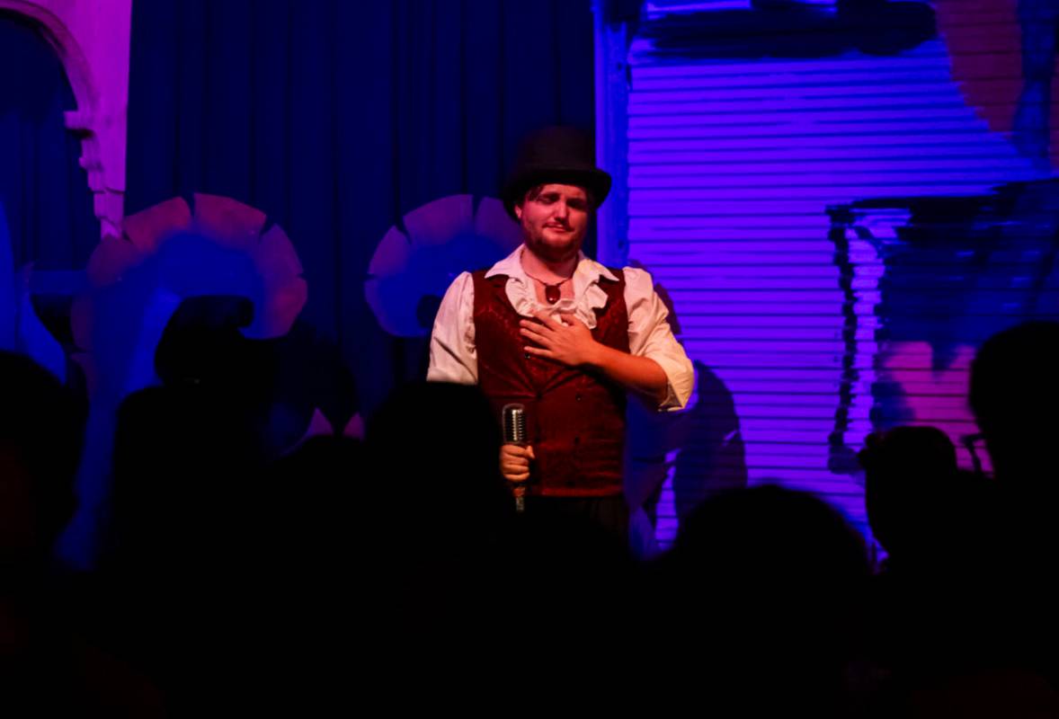 Emcee and magician William Bradshaw reacts during the closing night of Lost Spirits Distillery ...