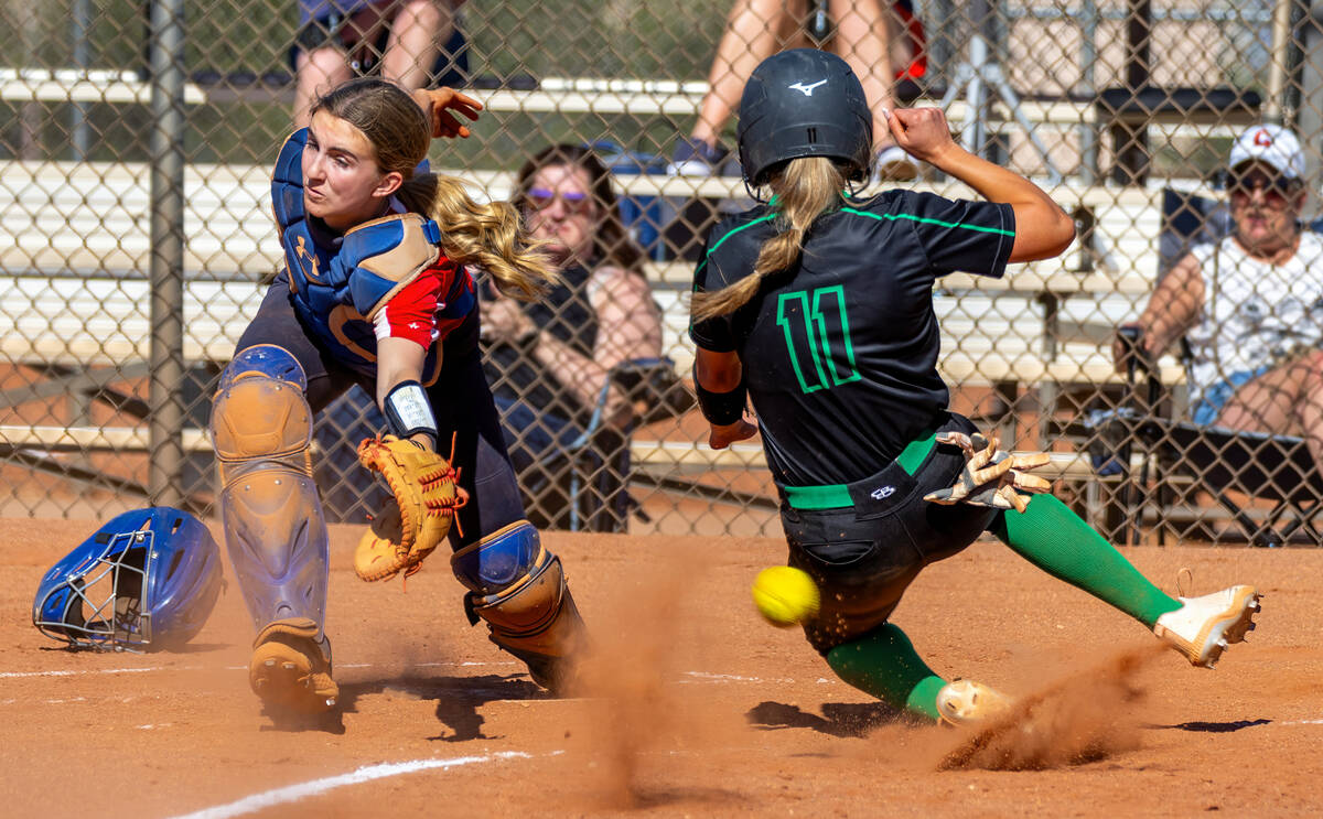 Coronado catcher Mary Lou Tsunis (10) is unable to grab a short throw as Palo Verde runner Tayl ...