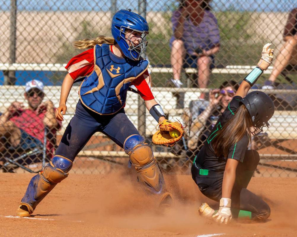 Coronado catcher Mary Lou Tsunis (10) is unable to make the tag as Palo Verde runner Alexis Kea ...