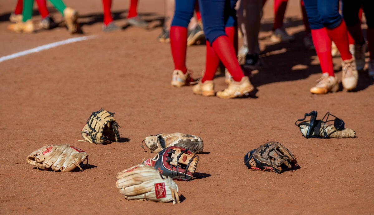 Palo Verde gloves lay in the dirt after defeating Coronado 2-0 following the seventh inning of ...