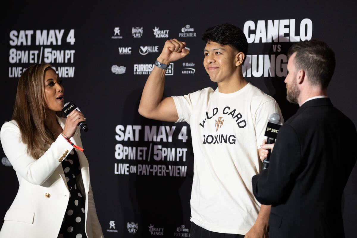 Jaime Munguia gestures during a news conference after arriving to MGM Grand ahead of his super ...