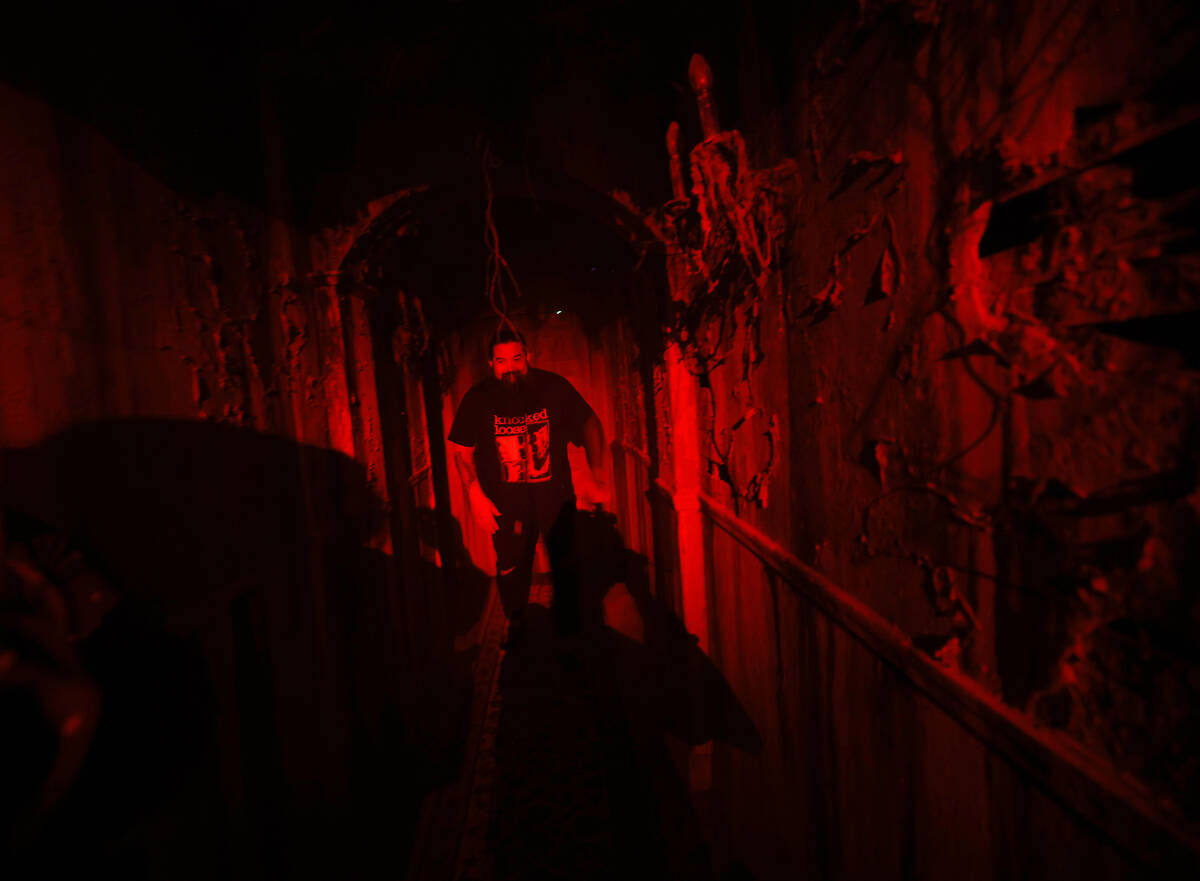 Justin Abundo, technical director of Escape IT, walks the hallway at Escape IT, Tuesday, April ...