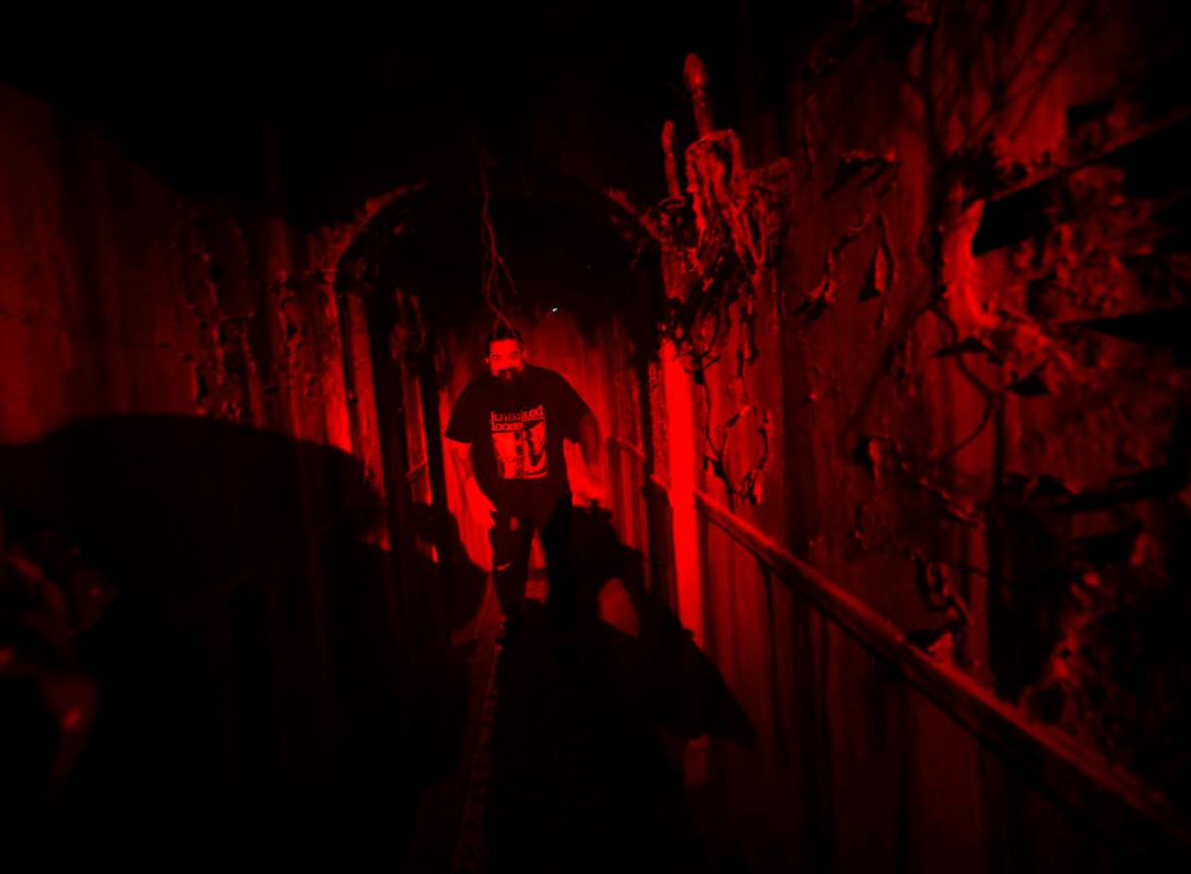 Justin Abundo, technical director of Escape IT, walks the hallway at Escape IT, Tuesday, April ...