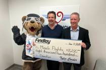 Caption: Miles the Bear, Miracle Flights’ mascot, Mark Brown, Miracle Flights CEO and Tyler C ...