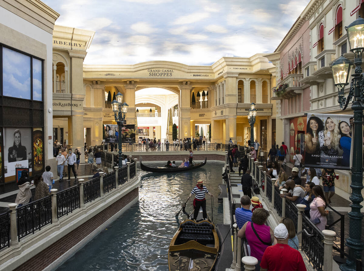 Tourists take a gondola ride in the Grand Canal at the Venetian hotel-casino photographed, on T ...