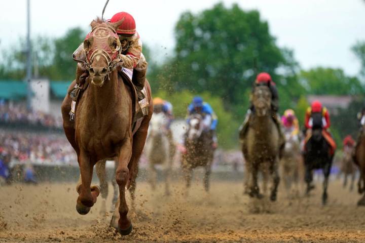 Rich Strike, with Sonny Leon aboard, wins the 148th running of the Kentucky Derby horse race at ...