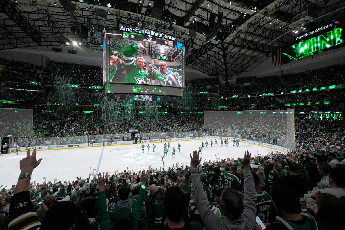 Fans celebrate the Dallas Stars 3-2 win against the Vegas Golden Knights in Game 5 of an NHL ho ...