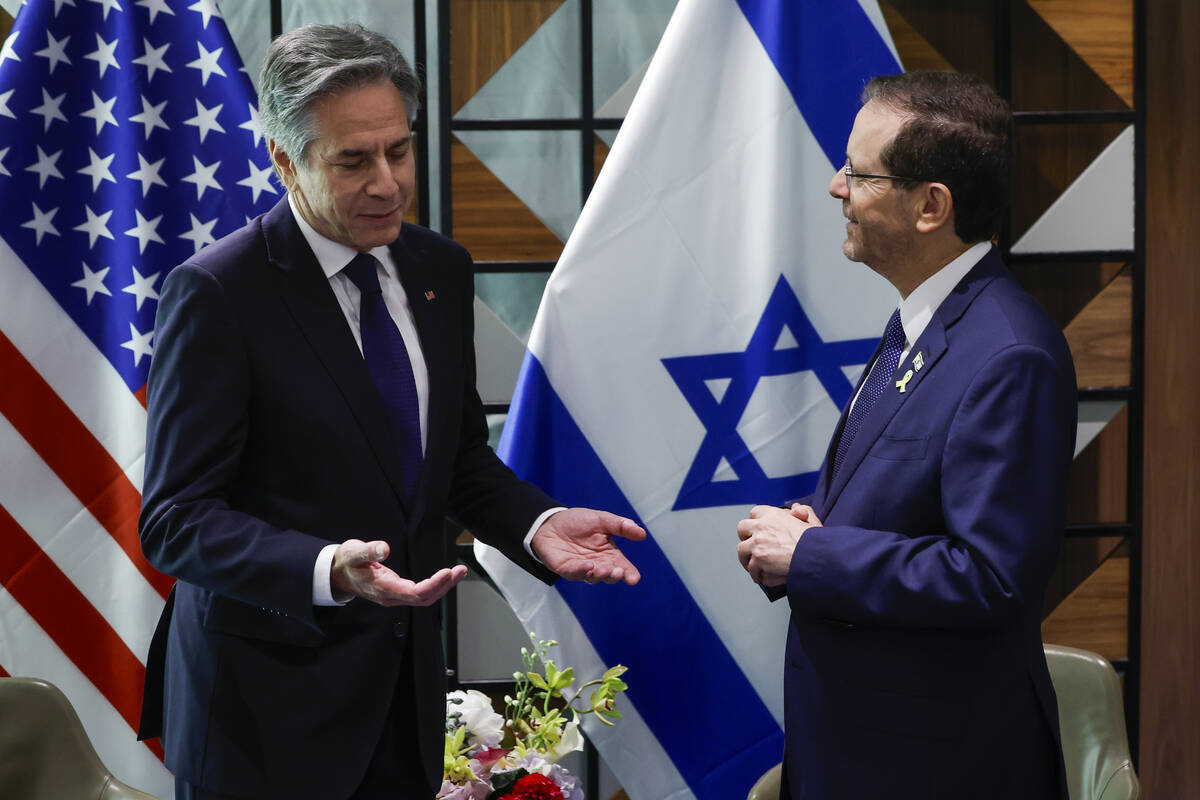 U.S. Secretary of State Antony Blinken, left, meets with Israeli President Isaac Herzog in Tel ...