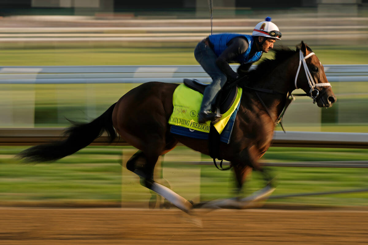 Kentucky Derby hopeful Catching Freedom works out at Churchill Downs Wednesday, May 1, 2024, in ...