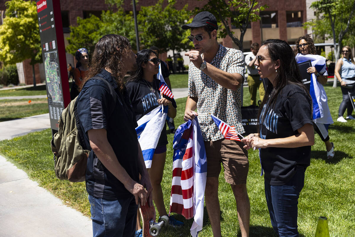 A Pro-Palestianian protester, left, argues with supporters of Israel on campus at UNLV on Wedne ...