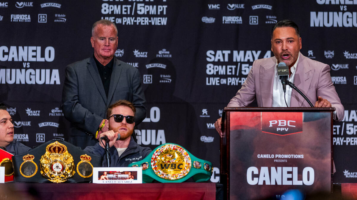 Boxing promotor Oscar De La Hoya and boxer Canelo Alvarez trade verbal punches during the final ...