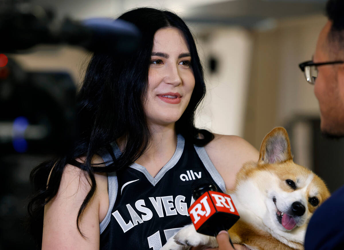 Las Vegas Aces center Megan Gustafson (17) holding her dog Pancake speaks during an interview w ...