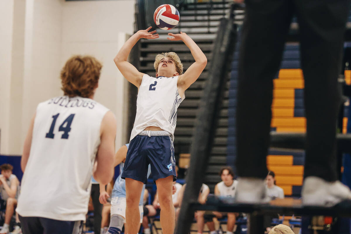 Centennial setter Thomas Taylor (2) attacks the ball during a boys volleyball game between Cent ...