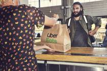 An Uber Eats delivery order is delivered to a customer in this file photo. (Courtesy Uber Eats)
