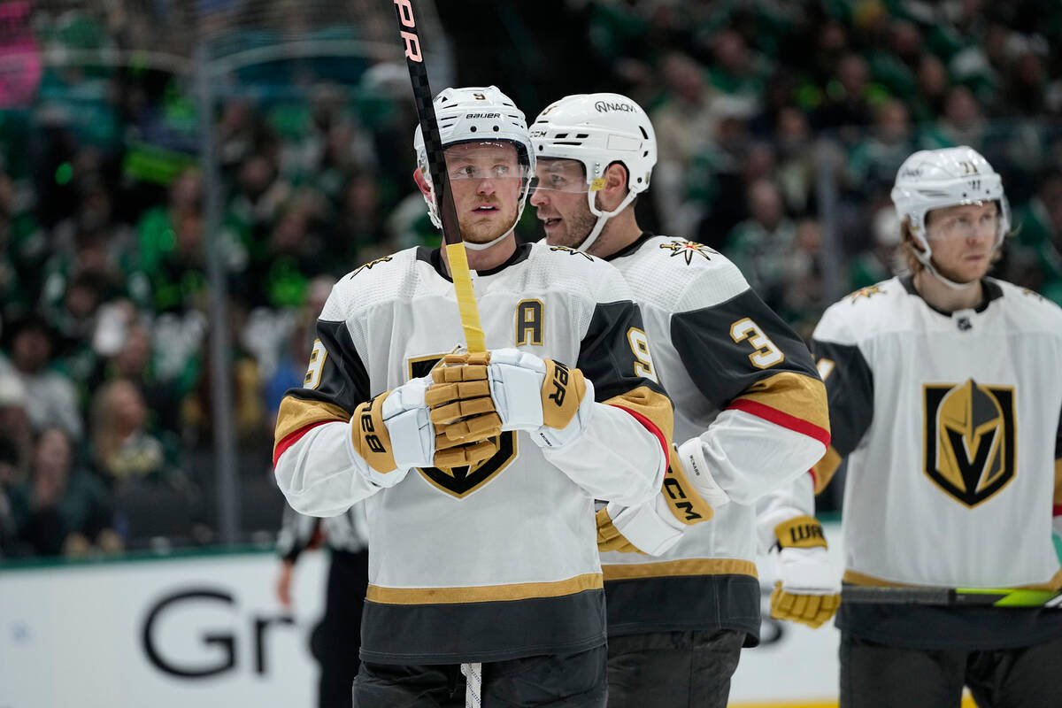 Vegas Golden Knights' Jack Eichel and Brayden McNabb (3) talk before a face off against the Dal ...
