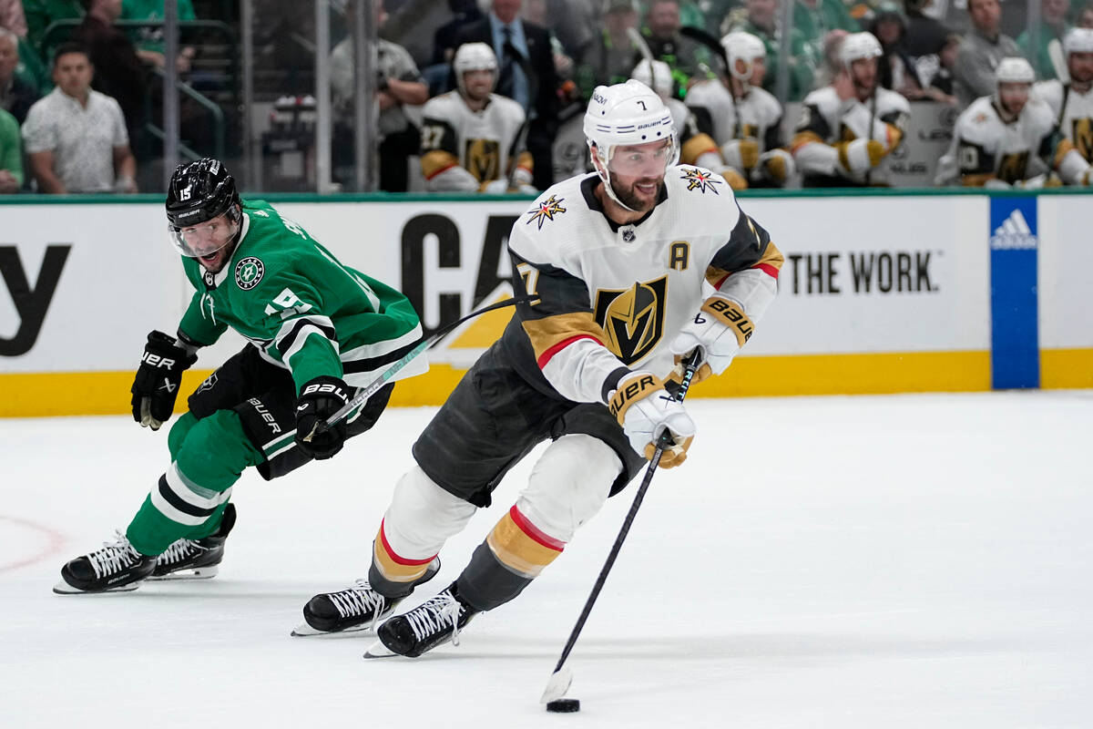 Vegas Golden Knights' Alex Pietrangelo controls the puck in front of Dallas Stars' Craig Smith ...