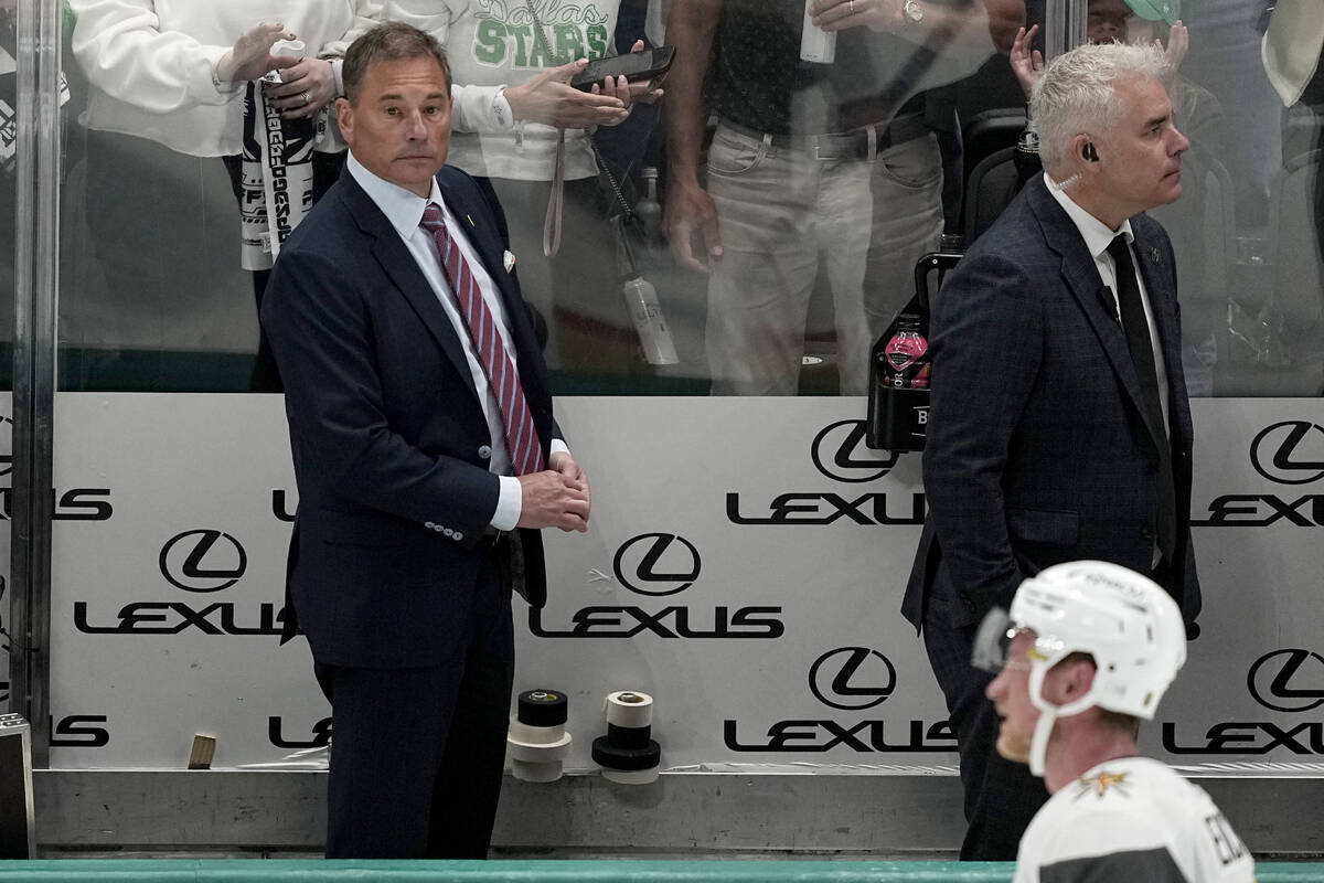 Vegas Golden Knights head coach Bruce Cassidy, left rear, and a member of his staff leave the b ...