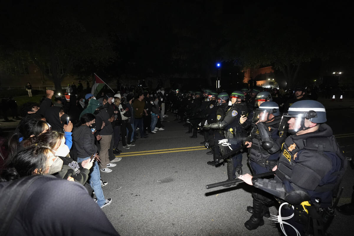 Police advance on demonstrators on the UCLA campus Thursday, May 2, 2024, in Los Angeles. (AP P ...