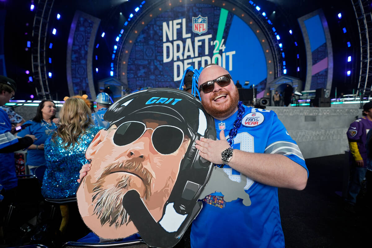 A Detroit Lions fan attends the first round of the NFL football draft, Thursday, April 25, 2024 ...