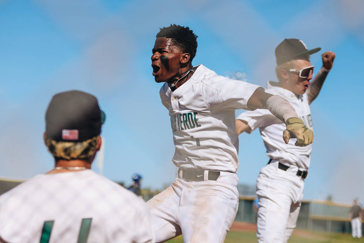 Palo Verde outfielder R.L. Chandler celebrates a home run with his teammates during a baseball ...