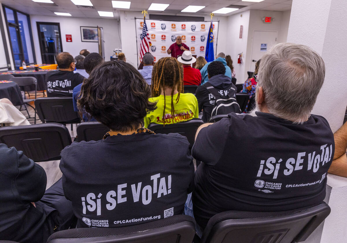 Participants listen as Joseph Garcia speaks during the 2024 Latino Loud nonpartisan voter regis ...