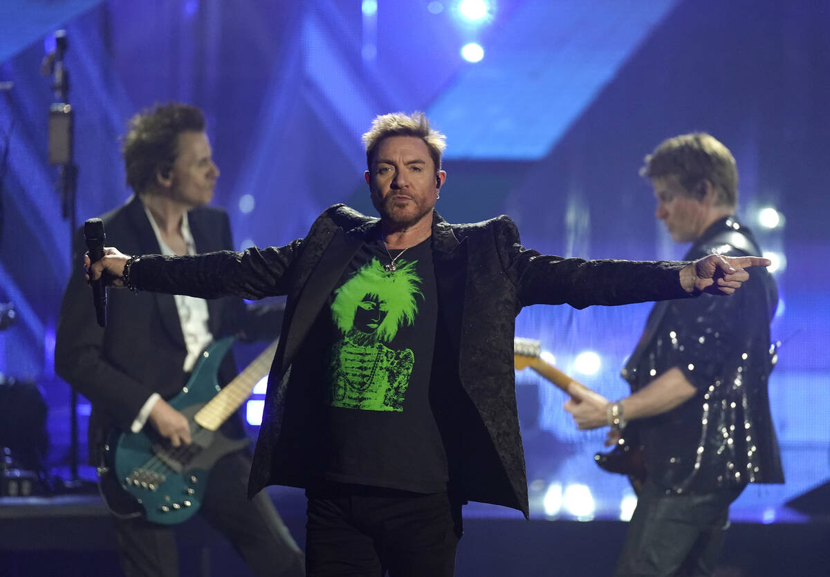 Inductees John Taylor, from left, Simon Le Bon, and Roger Taylor of Duran Duran perform during ...