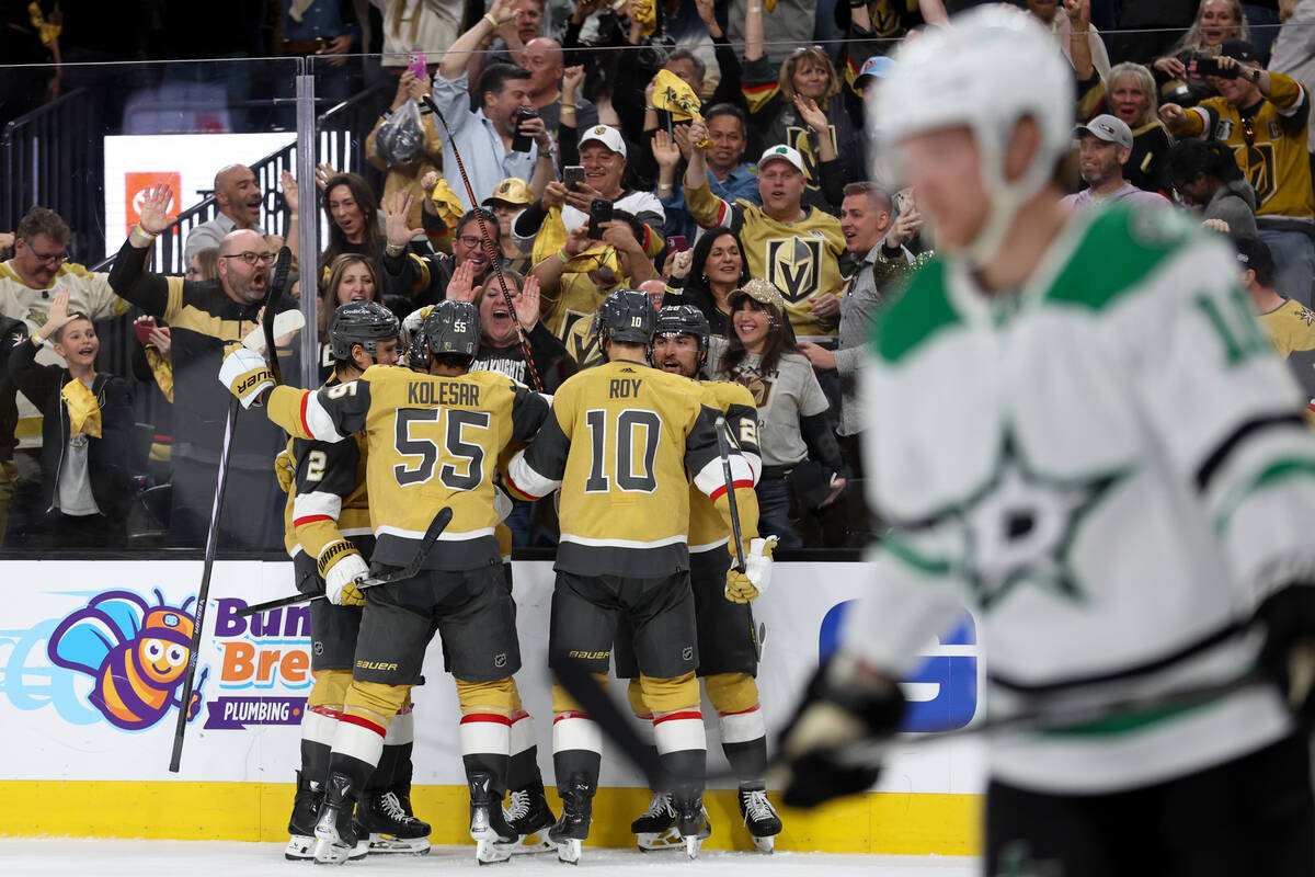 The Golden Knights celebrate after scoring during the third period in Game 6 of an NHL hockey S ...