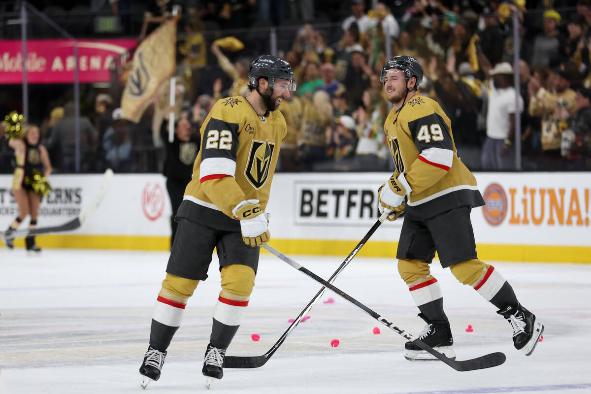 Golden Knights right wing Michael Amadio (22) and center Ivan Barbashev (49) skate on the ice a ...