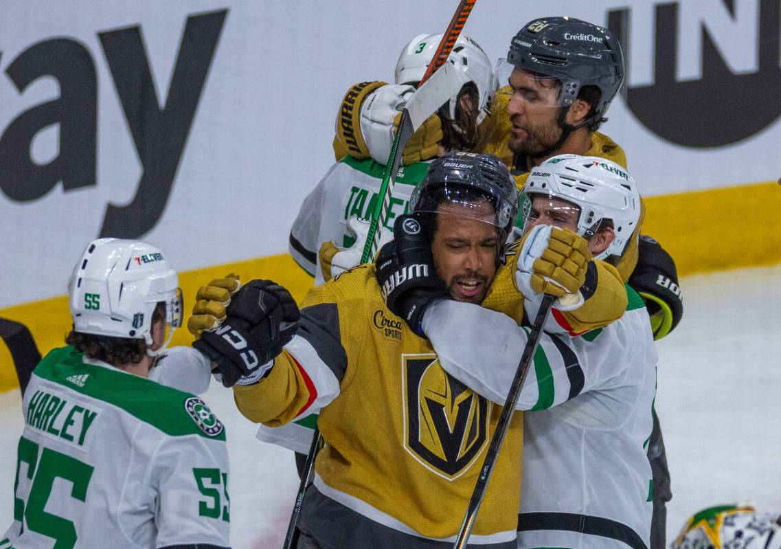 Golden Knights right wing Keegan Kolesar (55) is grabbed around the neck by Dallas Stars center ...