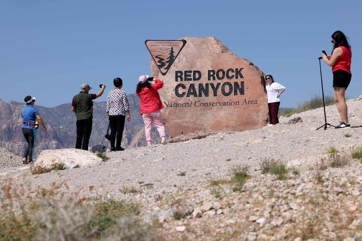 Tourists stop for photos on State Route 159 in Red Rock Canyon National Conservation Area outsi ...