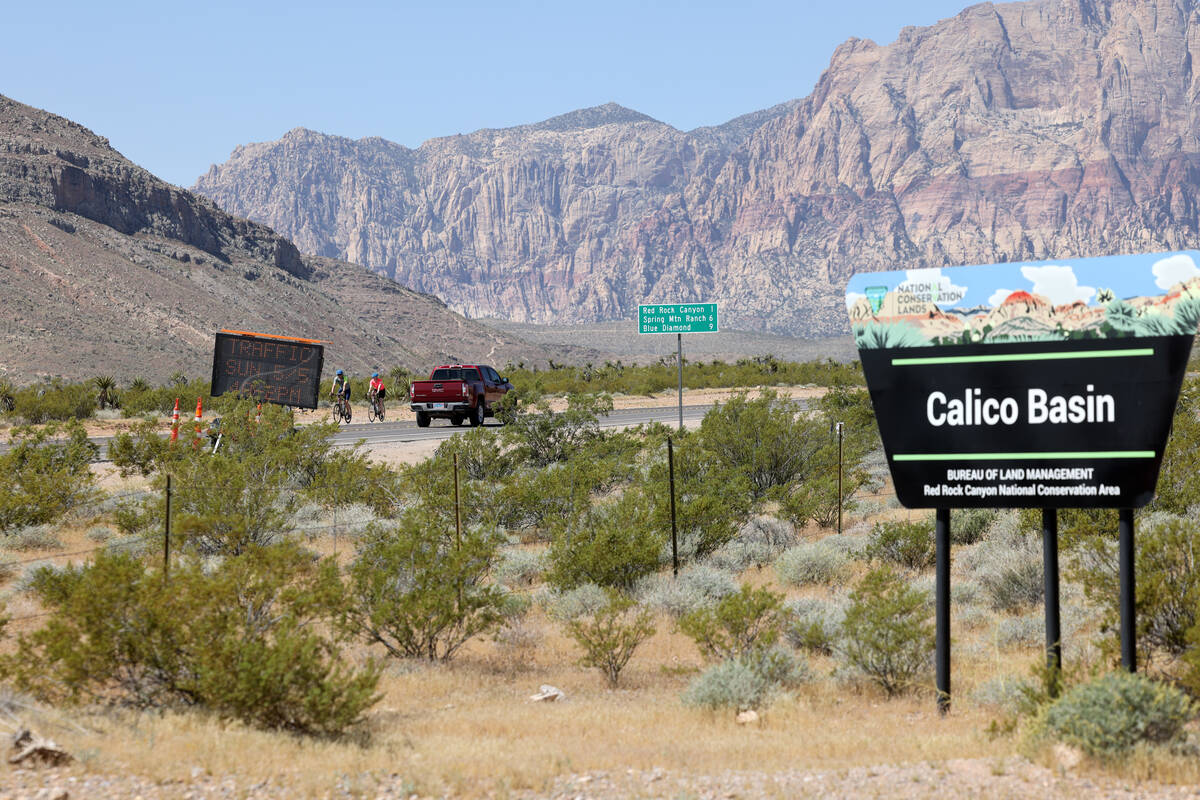 Motorists and cyclists move along State Route 159 near Calico Basin Road in Red Rock Canyon Nat ...