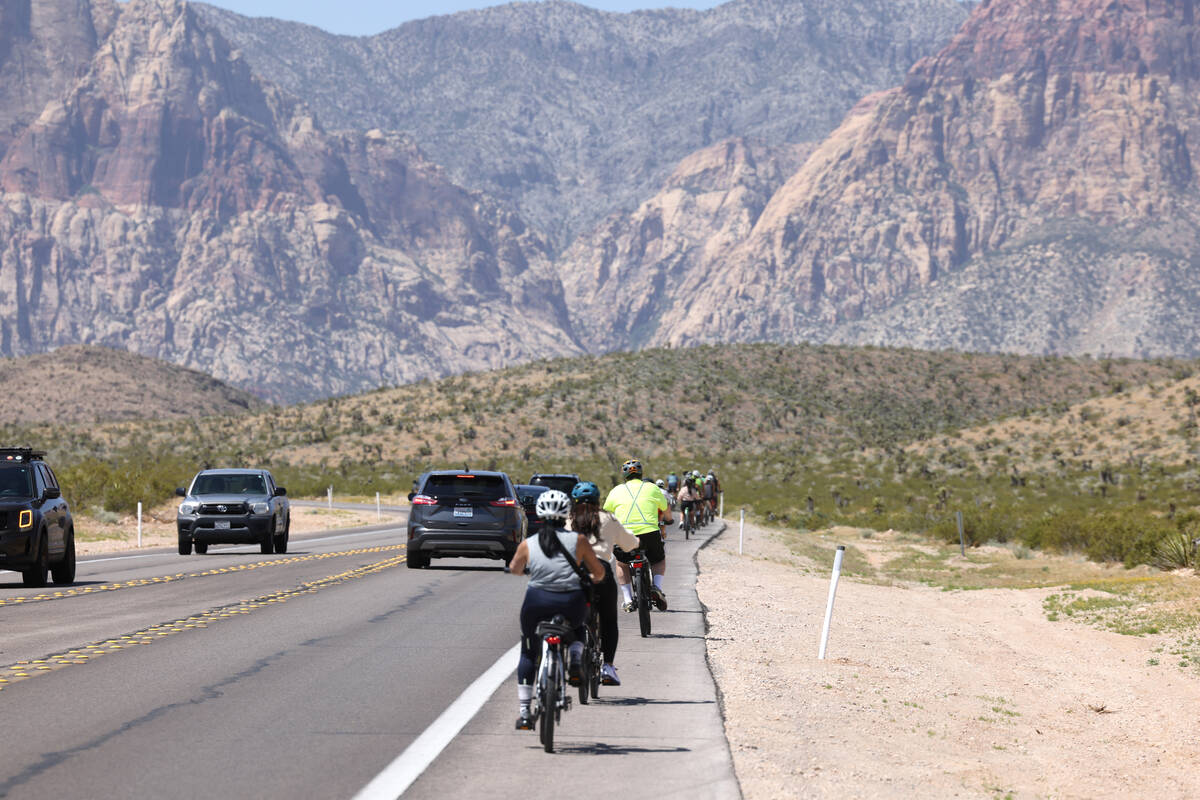 Cyclists and motorists move along State Route 159 near Calico Basin Road in Red Rock Canyon Nat ...