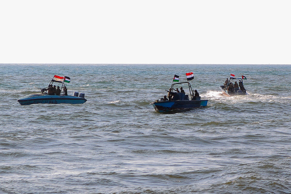 Members of the Yemeni Coast Guard affiliated with the Houthi group patrol the sea as demonstrat ...