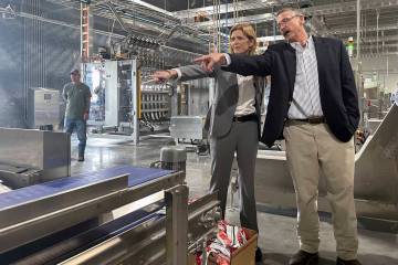 USAID Administrator Samantha Power talks with Mana operations director Harry Broughton during a ...