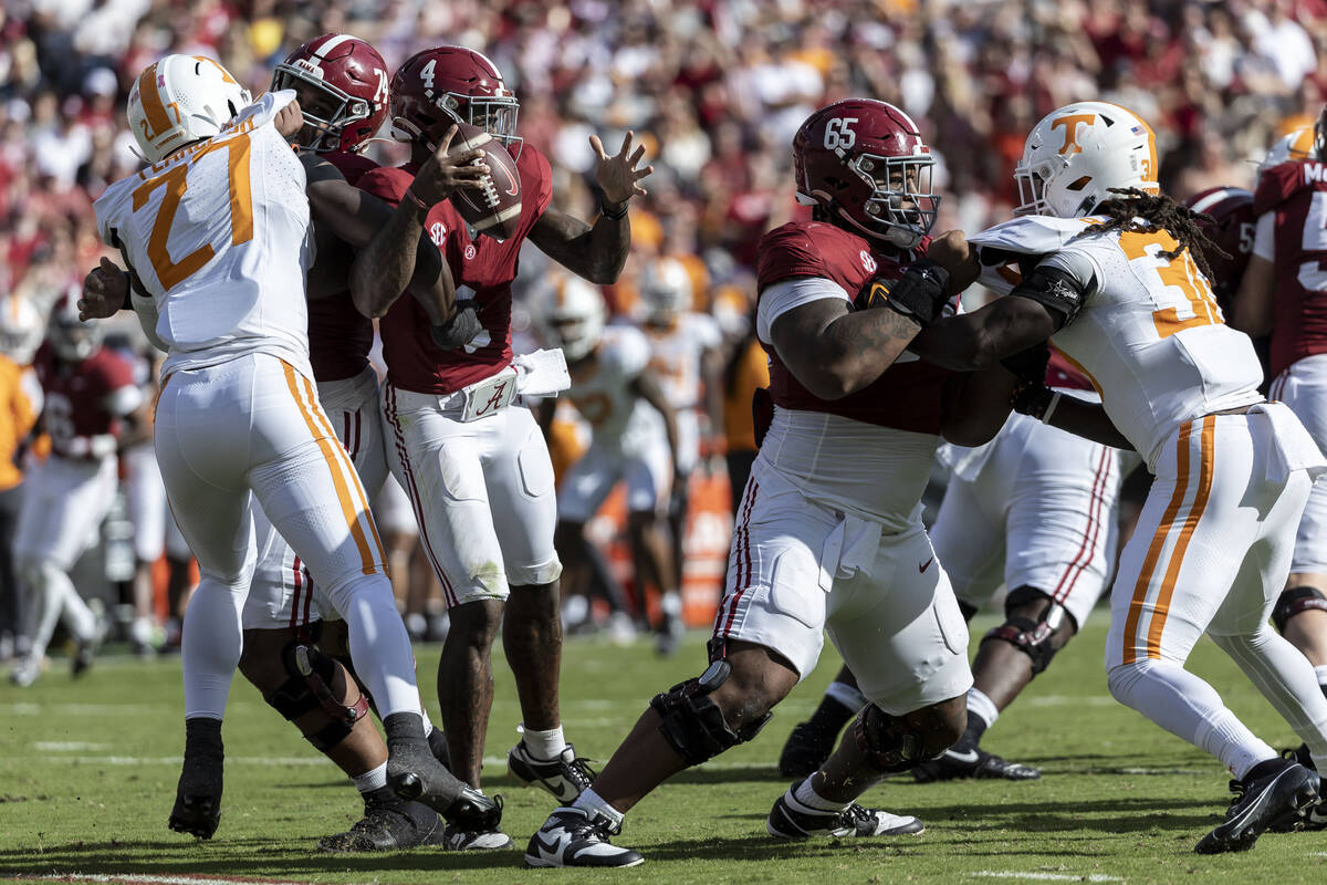 Tennessee defensive lineman James Pearce Jr. (27) strips the ball from Alabama quarterback Jale ...