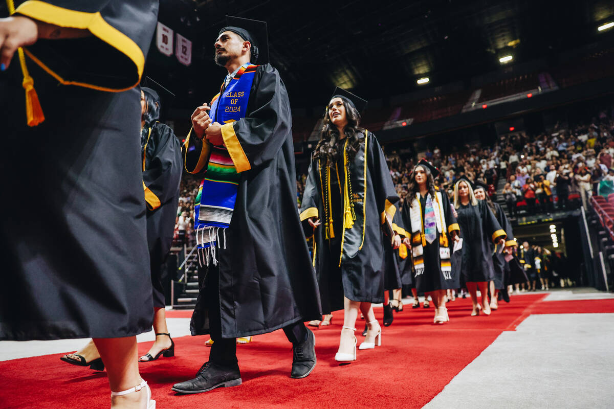 Graduates participate in the Nevada State University commencement ceremony at Thomas & Mack ...