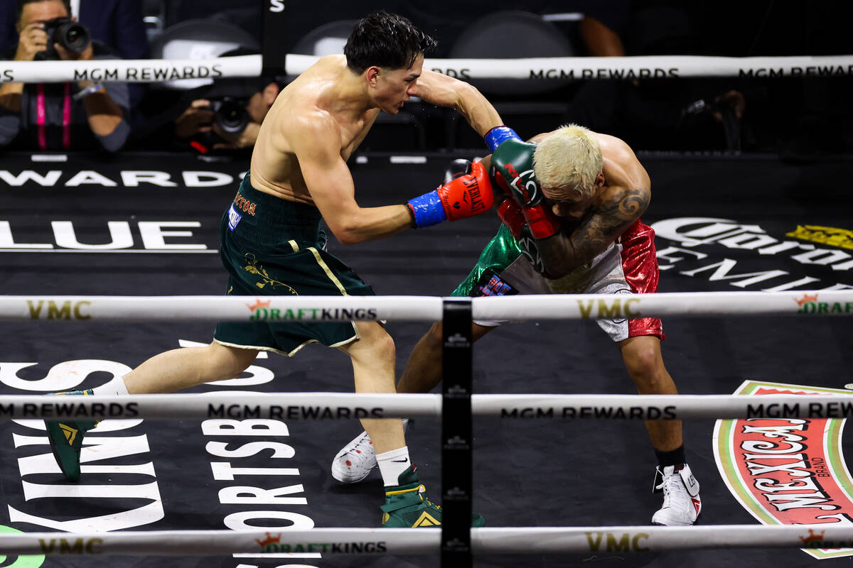 Brandon Figueroa, left, punches Jessie Magdaleno during a WBC interim world featherweight title ...