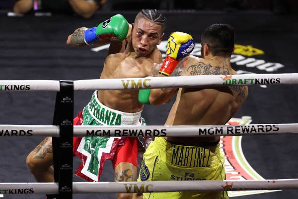 Mario Barrios gets a hit on Fabián Maidana in a WBC interim world welterweight title boxin ...