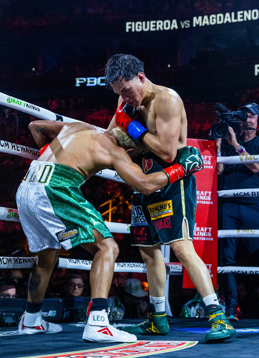 Featherweight Jessie Magdaleno dominated in the ring by Brandon Figueroa during the third round ...