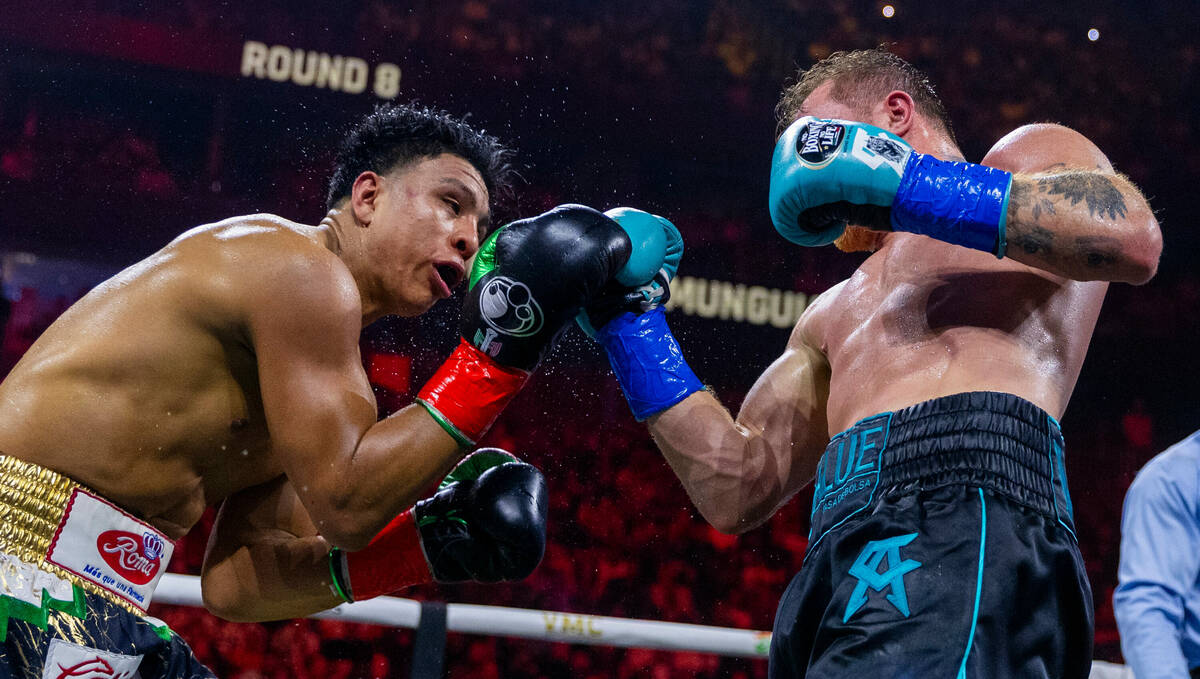 Jaime Munguia takes a shot to the chin from Canelo Alvarez during the eighth round of their PP ...